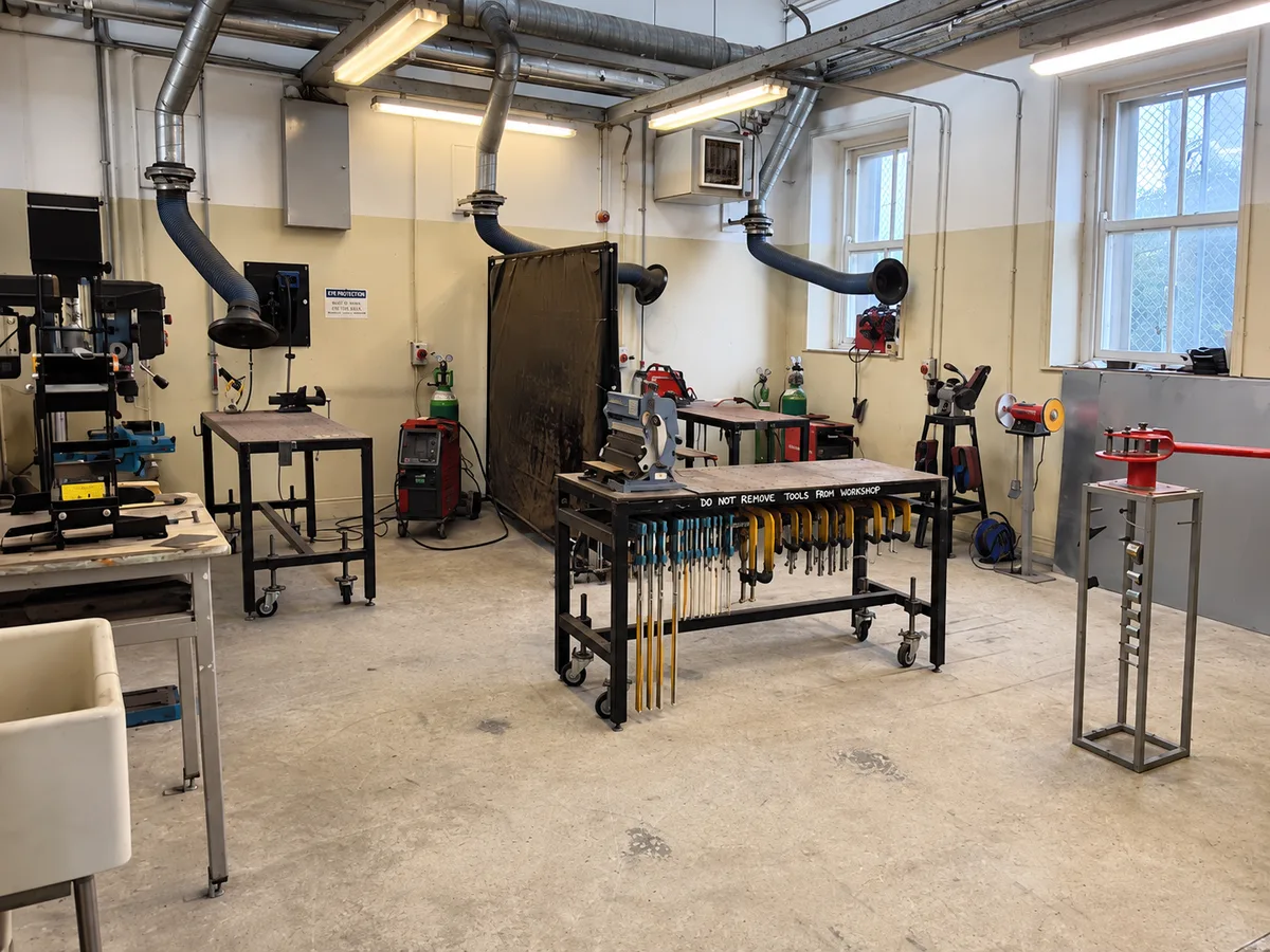 Hand tools stored around the Fabrication Station workbenches